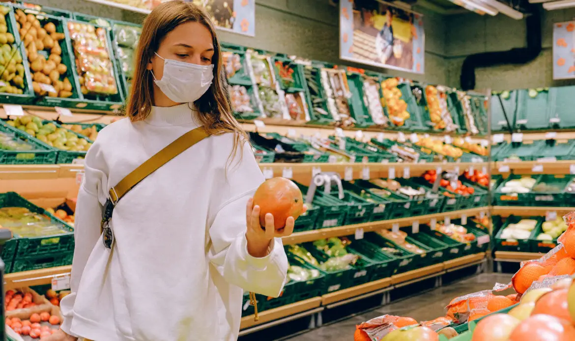 Woman wearing mask in supermarket