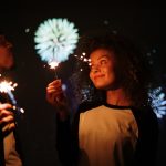 Couple holding sparklers