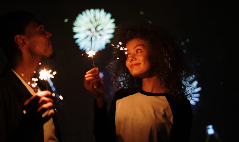 Couple holding sparklers