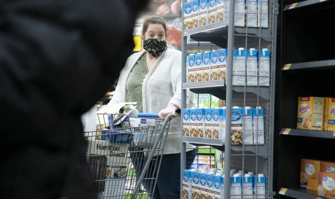 Illinois, United States, - April 10th 2020: A Walmart customer ina  face mask attempting to get groceries during the pandemic.