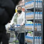 Illinois, United States, - April 10th 2020: A Walmart customer ina  face mask attempting to get groceries during the pandemic.