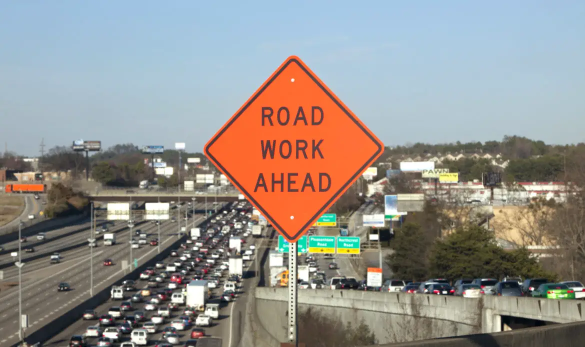 Road Work Ahead Sign with traffic