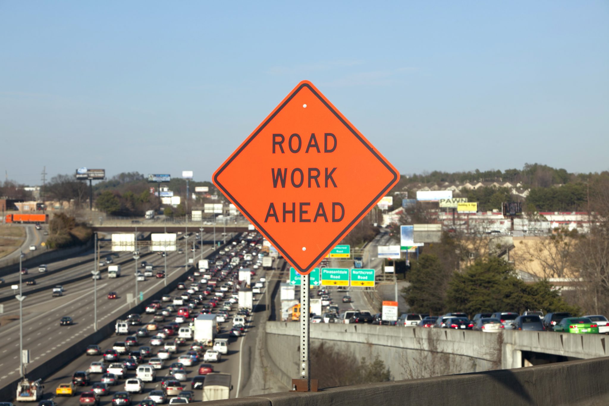 Road Work Ahead Sign with traffic