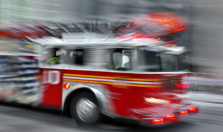 Fire trucks and firefighters brigade in the city
