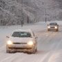 Two Cars Driving in Snow