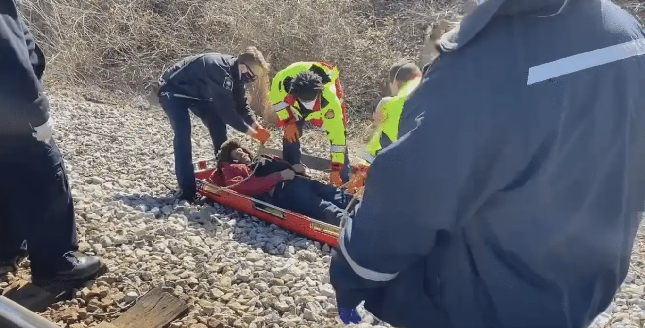 Railroad conductor saves life of man stuck on tracks