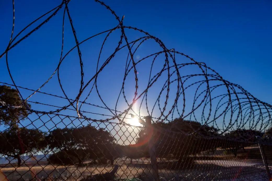 Fence with barbed wire