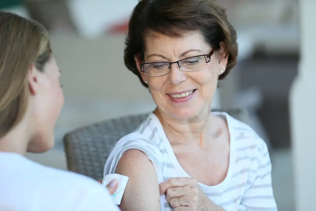 Woman receiving flu vaccine