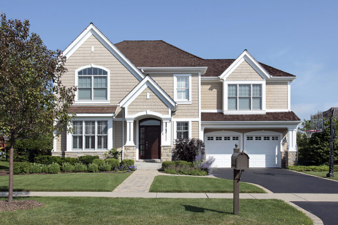 Home with brown cedar roof