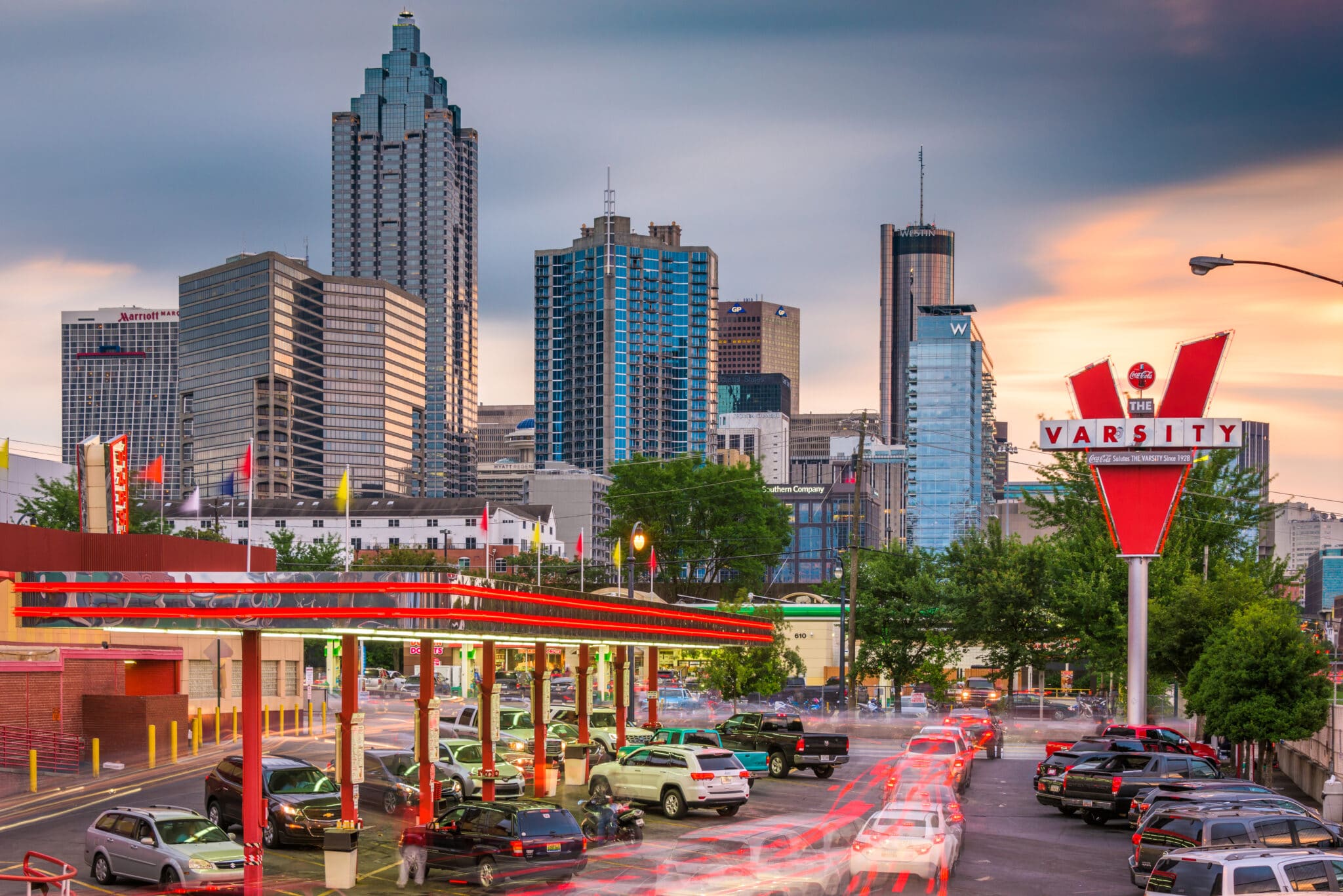 The Varsity, Atlanta's renowned drive-in restaurant, has been serving iconic fast food since 1928. Known for its massive size, unique ordering lingo, and signature Frosted Orange drink, it draws locals and visitors alike. The restaurant maintains its commitment to affordable pricing and has expanded to multiple locations while preserving its historical charm.