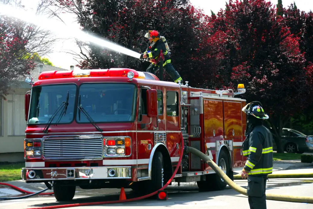 Firemen and fire truck at an apartment fire