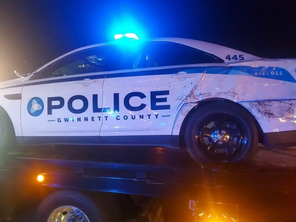 Two Gwinnett Police cars were hit on I-85 Sunday morning