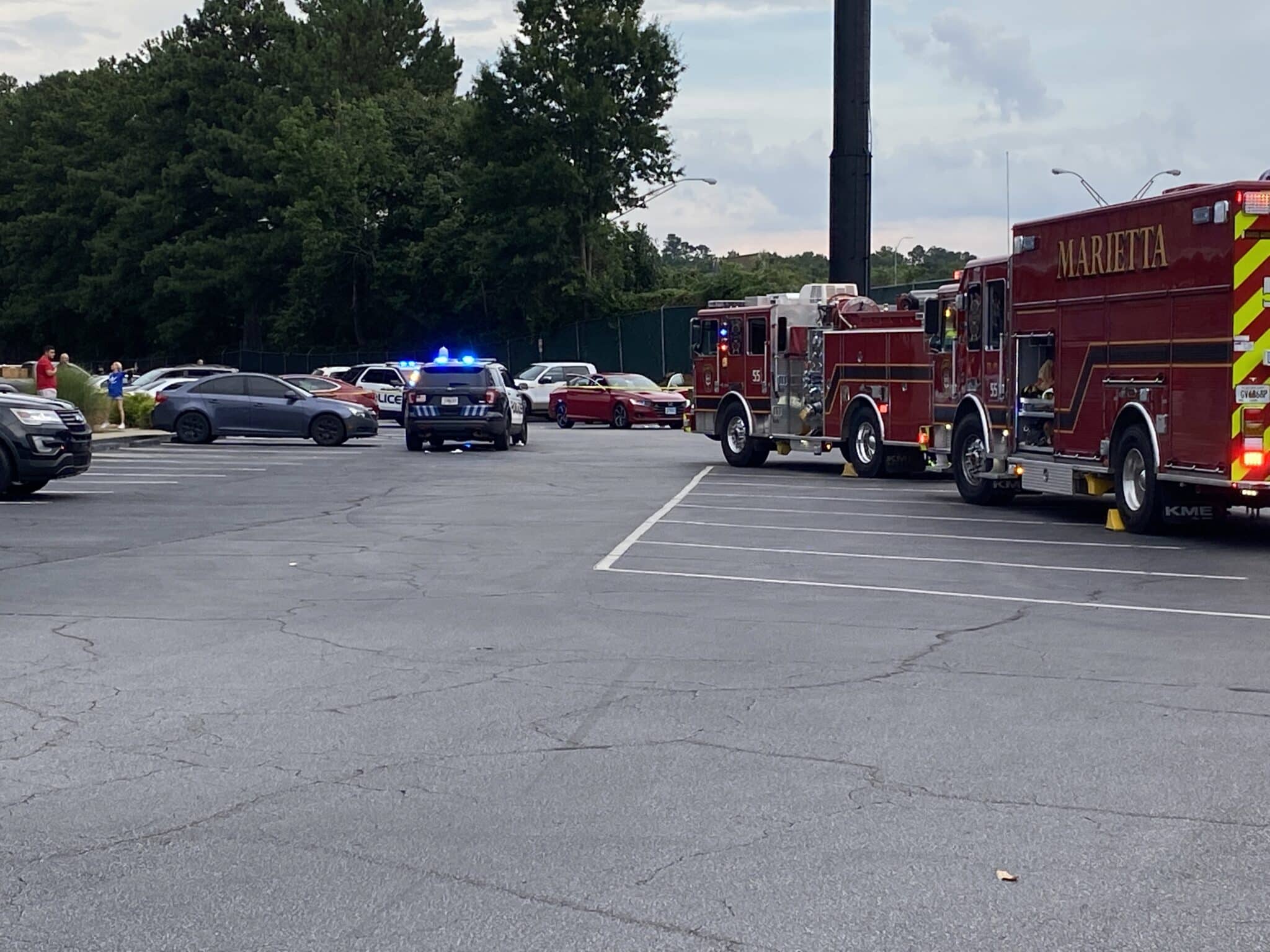 Police kill Georgia man they say pinned an officer between two cars and then dragged him