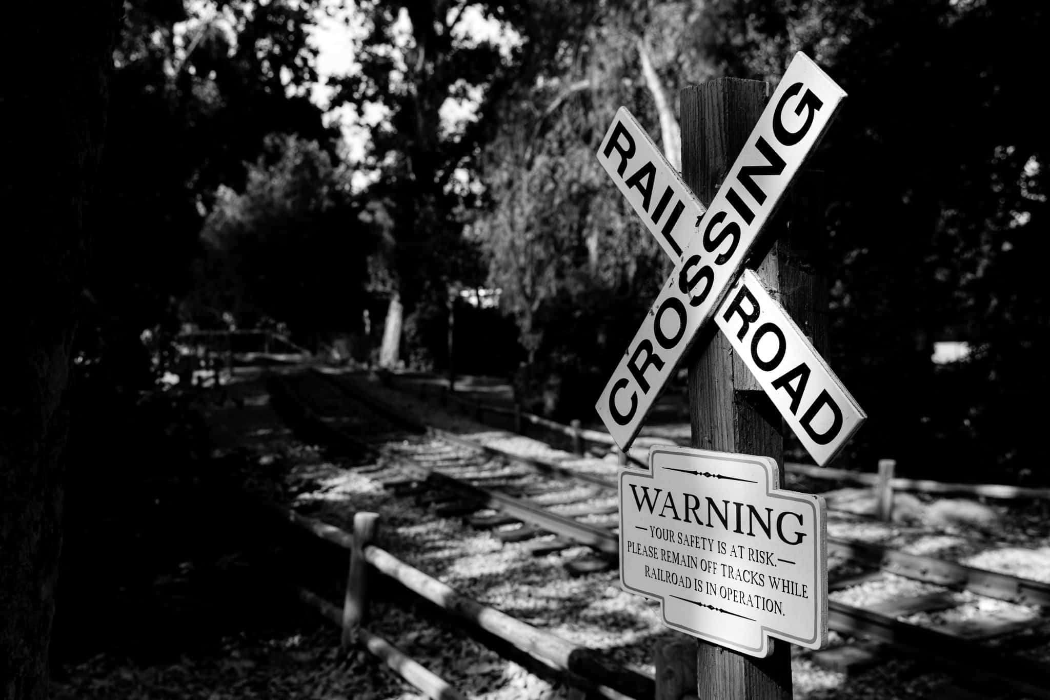 Railroad crossing sign near railway