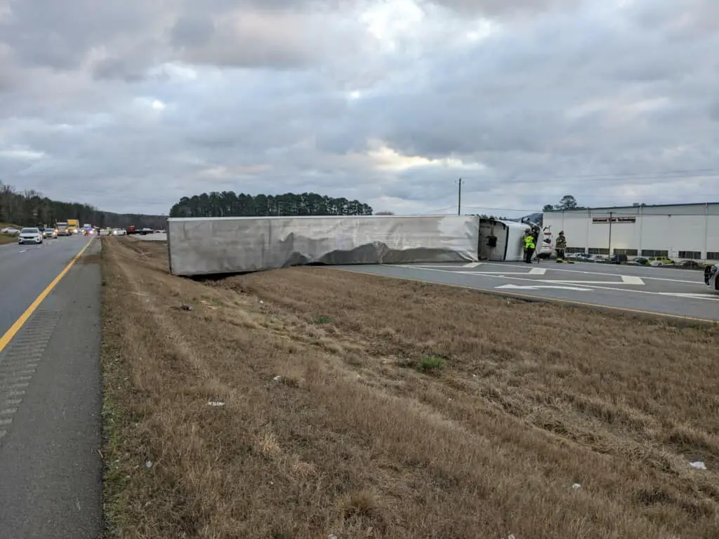 Overturned tractor-trailer stops traffic in Floyd County