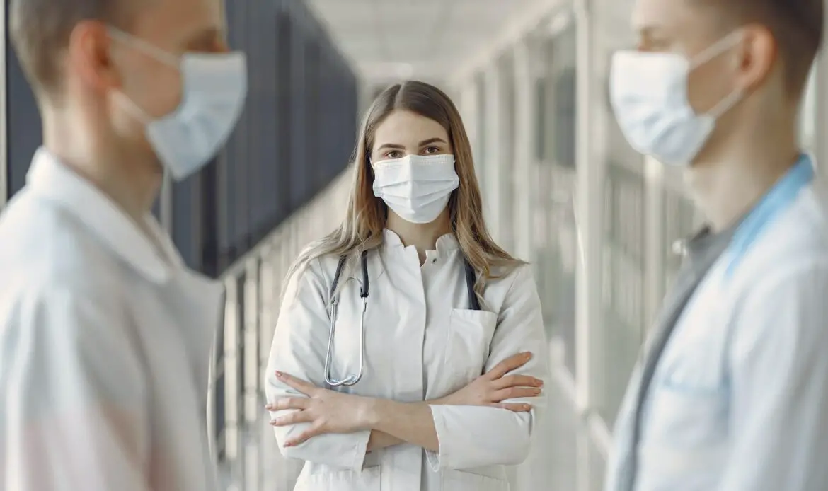 Woman in White Coat Wearing White Face Mask