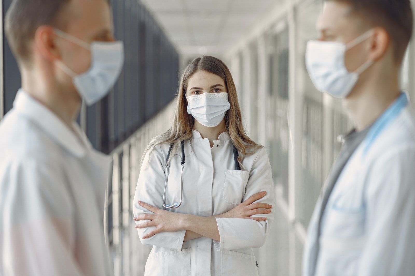 Woman in White Coat Wearing White Face Mask