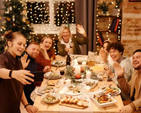 Family Celebrating Christmas Dinner While Taking Selfie