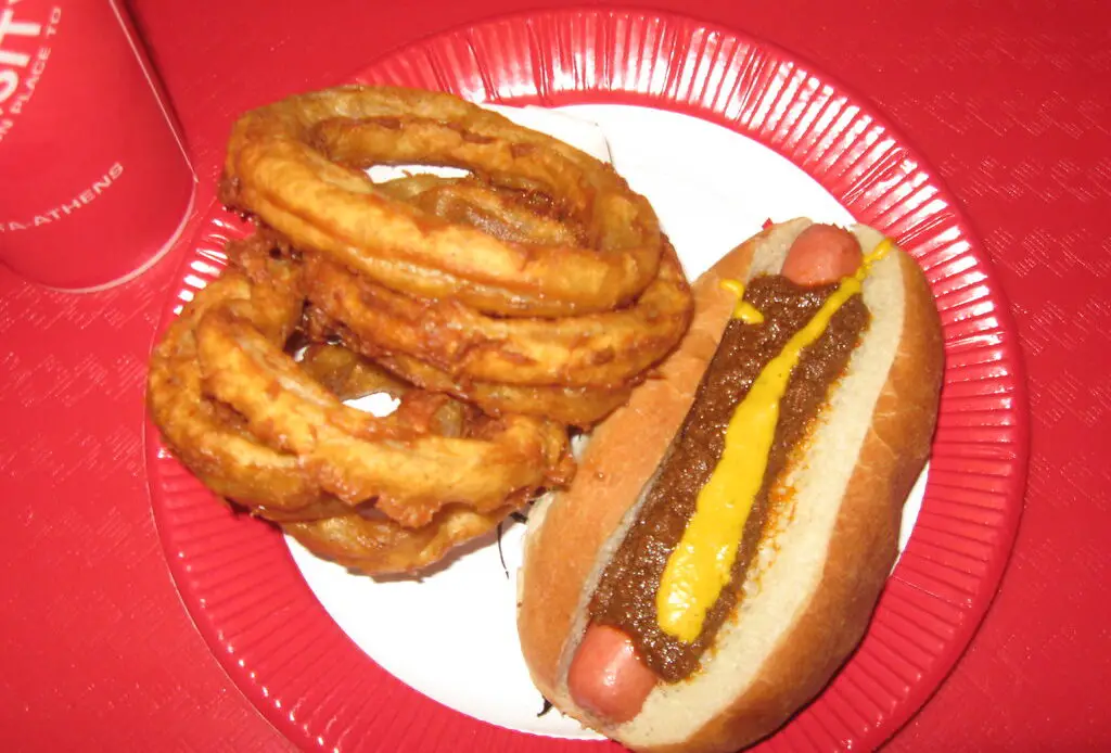 The Varsity, Atlanta's renowned drive-in restaurant, has been serving iconic fast food since 1928. Known for its massive size, unique ordering lingo, and signature Frosted Orange drink, it draws locals and visitors alike. The restaurant maintains its commitment to affordable pricing and has expanded to multiple locations while preserving its historical charm.