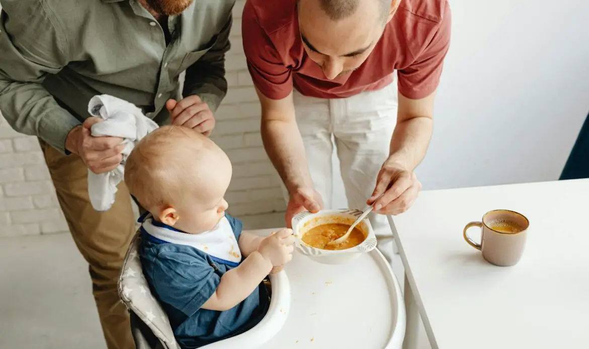 Parents Feeding Baby at Breakfast