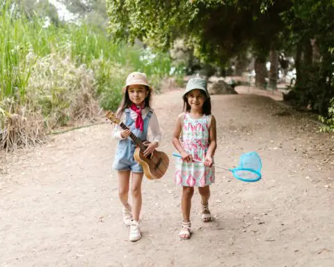 Little Girls in Panama Hats Walking
