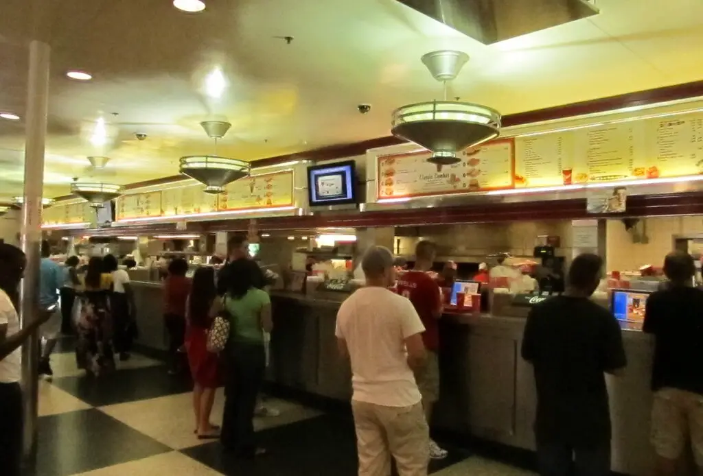 The Varsity, Atlanta's renowned drive-in restaurant, has been serving iconic fast food since 1928. Known for its massive size, unique ordering lingo, and signature Frosted Orange drink, it draws locals and visitors alike. The restaurant maintains its commitment to affordable pricing and has expanded to multiple locations while preserving its historical charm.