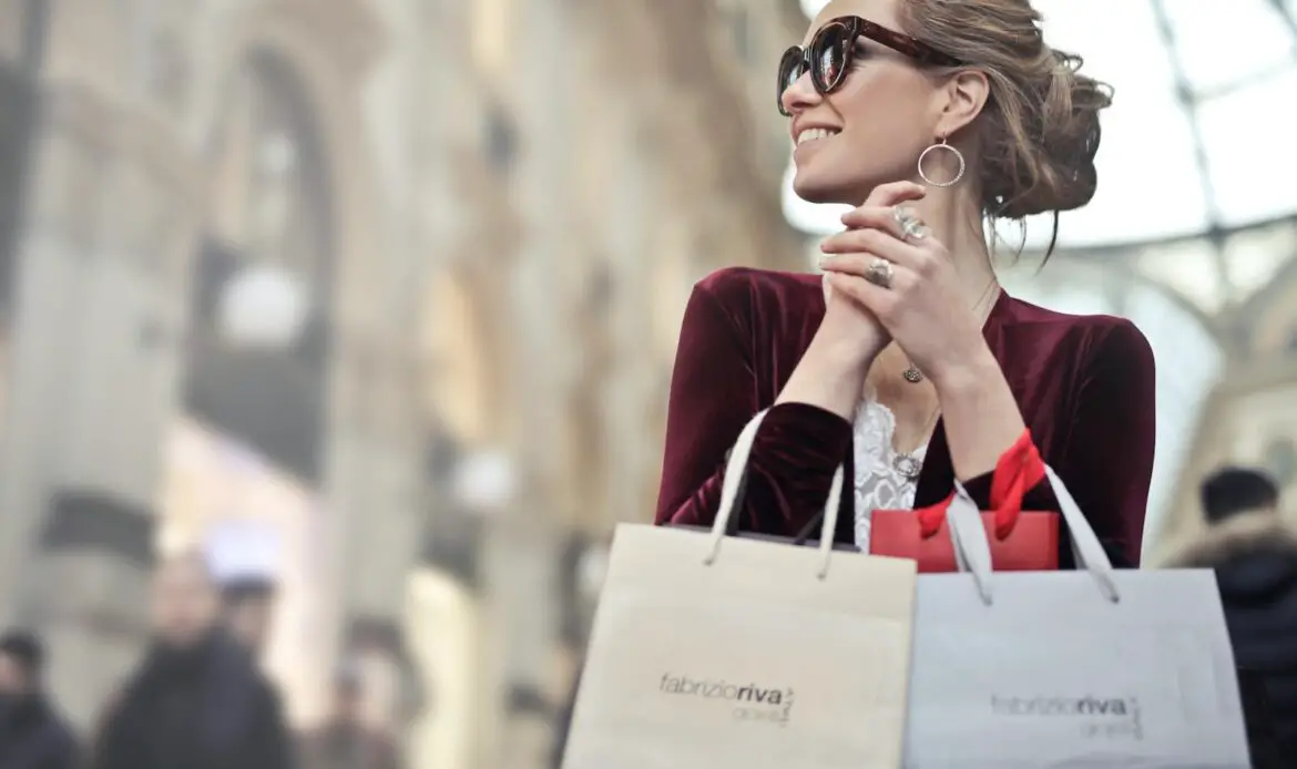 Stylish woman with shopping bags in Galleria Vittorio Emanuele II, Milan.