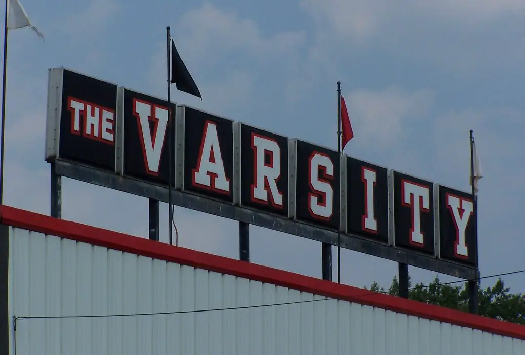 The Varsity, Atlanta's renowned drive-in restaurant, has been serving iconic fast food since 1928. Known for its massive size, unique ordering lingo, and signature Frosted Orange drink, it draws locals and visitors alike. The restaurant maintains its commitment to affordable pricing and has expanded to multiple locations while preserving its historical charm.