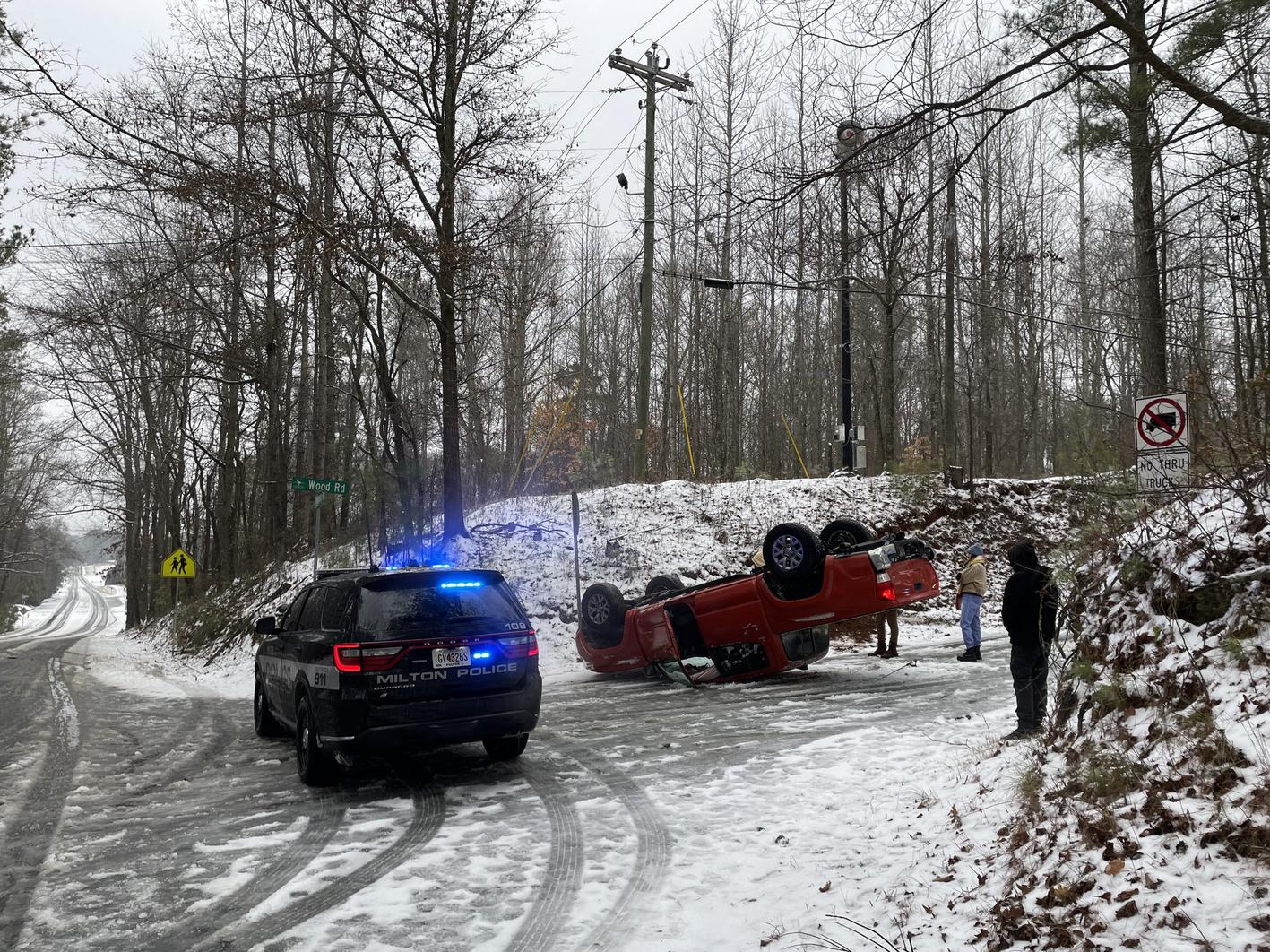 What’s Happening: Slush and freezing rain have made Milton’s roads increasingly hazardous. Ice is accumulating on both streets and trees, and conditions are expected to deteriorate as temperatures drop into the evening. One significant incident occurred around 11:30 a.m. Friday when a truck flipped over near the intersection of Wood Road and Birmingham Highway.