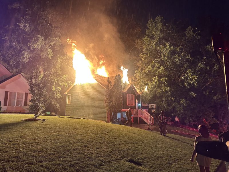 A fast-moving thunderstorm sparked a devastating house fire in Lawrenceville early Tuesday, displacing a family of 11 and leaving one firefighter injured during rescue efforts.