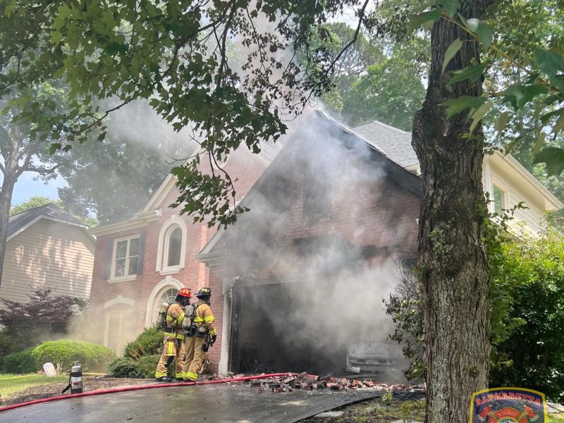 Alpharetta firefighters successfully contained a garage fire Saturday afternoon, saving both human and feline lives while preventing the blaze from destroying the entire home.