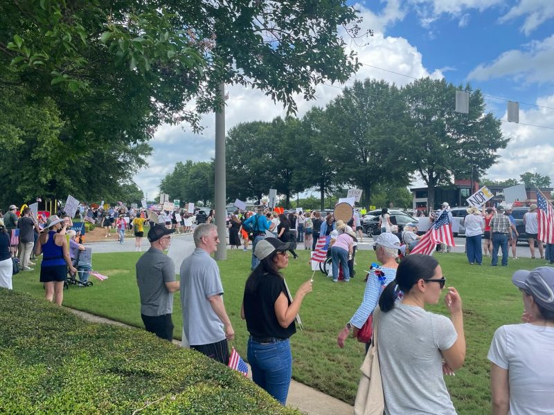 An estimated 2,000 people gathered Saturday in Johns Creek to take part in the No Kings protest — a nationwide demonstration organized in opposition to former President Donald Trump’s military parade in Washington.