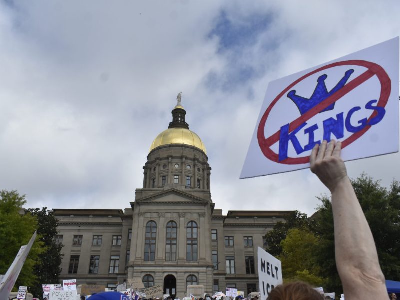 Minutes after Atlanta’s “No Kings” protest began Saturday outside the state Capitol, organizers announced that the venue’s 5,000-person capacity had been reached.