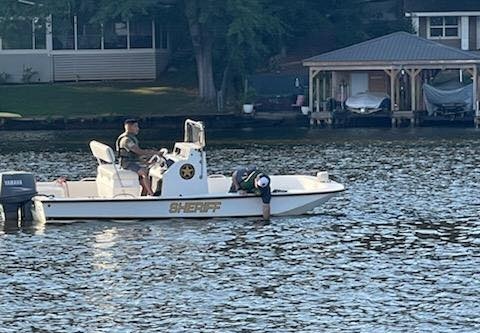Rescue teams are still looking for a 30-year-old man who fell off a jet ski and disappeared under the water at Lake Sinclair. Boats with sonar, underwater robots, and dogs are helping in the search.