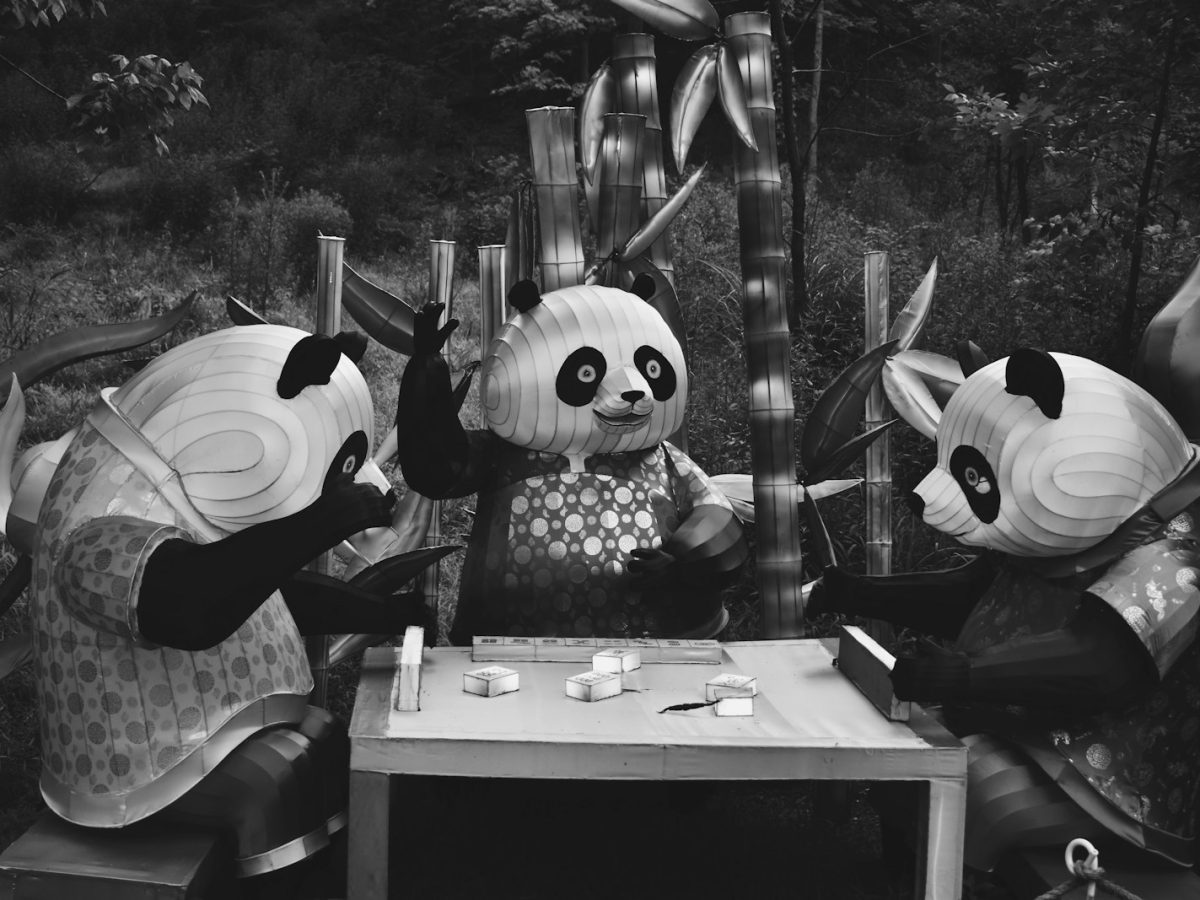 a group of people in clothing sitting at a table