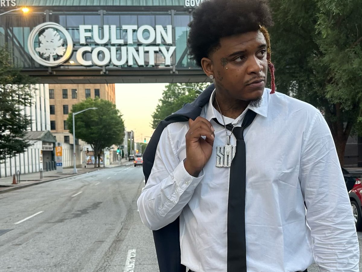 A man is in custody after Gwinnett County police say 33-year-old rapper T-Hood was shot at a Snellville home and later died at the hospital.