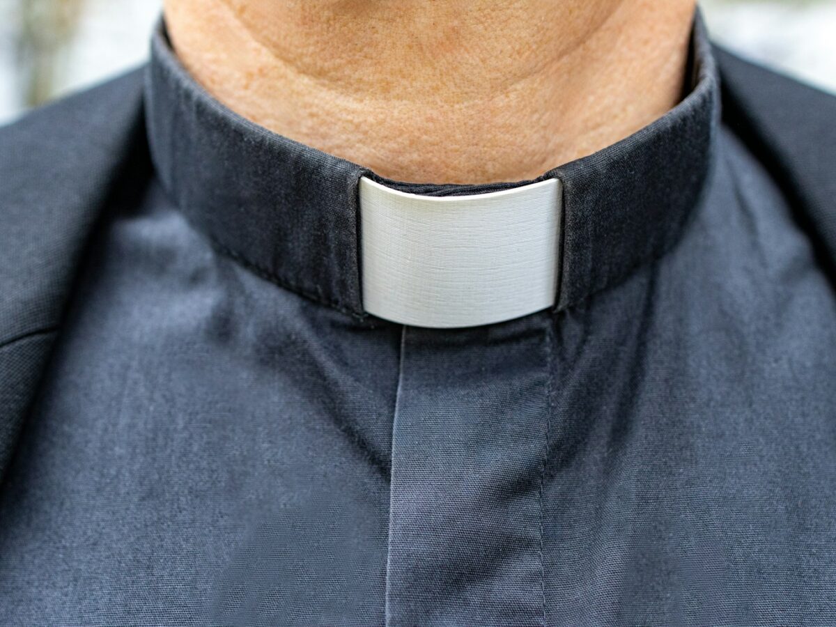 a close up of a man wearing a neck tie