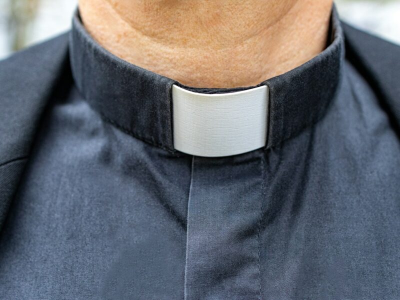 a close up of a man wearing a neck tie