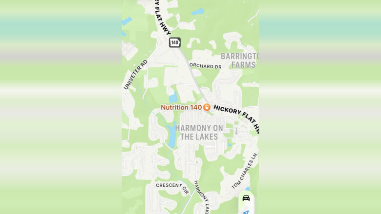Map showing the area of Harmony on the Lakes, with nearby roads including Hickory Flat Hwy (Highway 140), Univeter Rd, Orchard Dr, Crescent Cir, Harmony Lakes Dr, and Tom Charles Ln. The location "Nutrition 140" is marked near the center of the map. Barrington Farms is indicated to the northeast. The map features residential streets and some bodies of water.