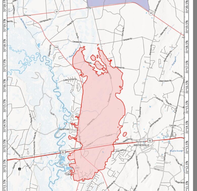 Map showing the wildfire perimeter outlined in red near Hwy 82 in the Pio area, dated April 25, 2026. The affected area covers 9,578 acres as of April 24, 2026, 2244 hours. The map includes roads such as Hwy 82, Hwy 259, Hwy 110, and Hwy 32, with nearby locations including Waynesville and Needmore. Water bodies and creeks are marked in blue, and the map uses the North American 1983 Datum with latitude and longitude grid lines. A scale bar indicates distances up to 2 miles.