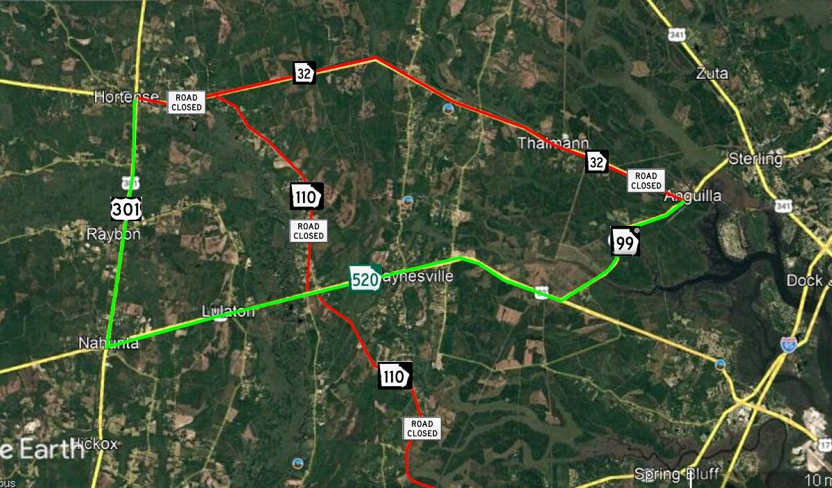Map showing road closures and open routes around Waynesville, Nahunta, and surrounding areas. Closed roads are marked in red with "ROAD CLOSED" signs on highways 32 and 110. Open routes are marked in green on highways 301, 520, and 99. Nearby towns include Hortense, Raybon, Lulaton, Thalmann, Anguilla, Sterling, Zuta, and Spring Bluff. Major highways visible include 301, 32, 110, 520, 99, 341, and I-95.