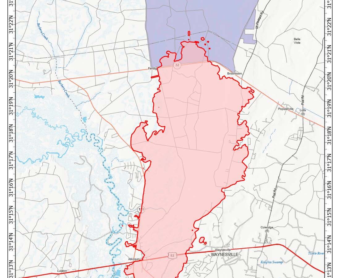 Map showing the wildfire perimeter outlined in red and shaded in light red near Waynesville, Georgia, along Highway 82. The wildfire area covers 20,933 acres as of April 26, 2026. Nearby features include Penholoway Bay to the north, Barber Creek to the west, and various roads such as Atkinson, Post Road, and Mt Pleasant Road. The map includes a scale in miles and a compass rose indicating north.