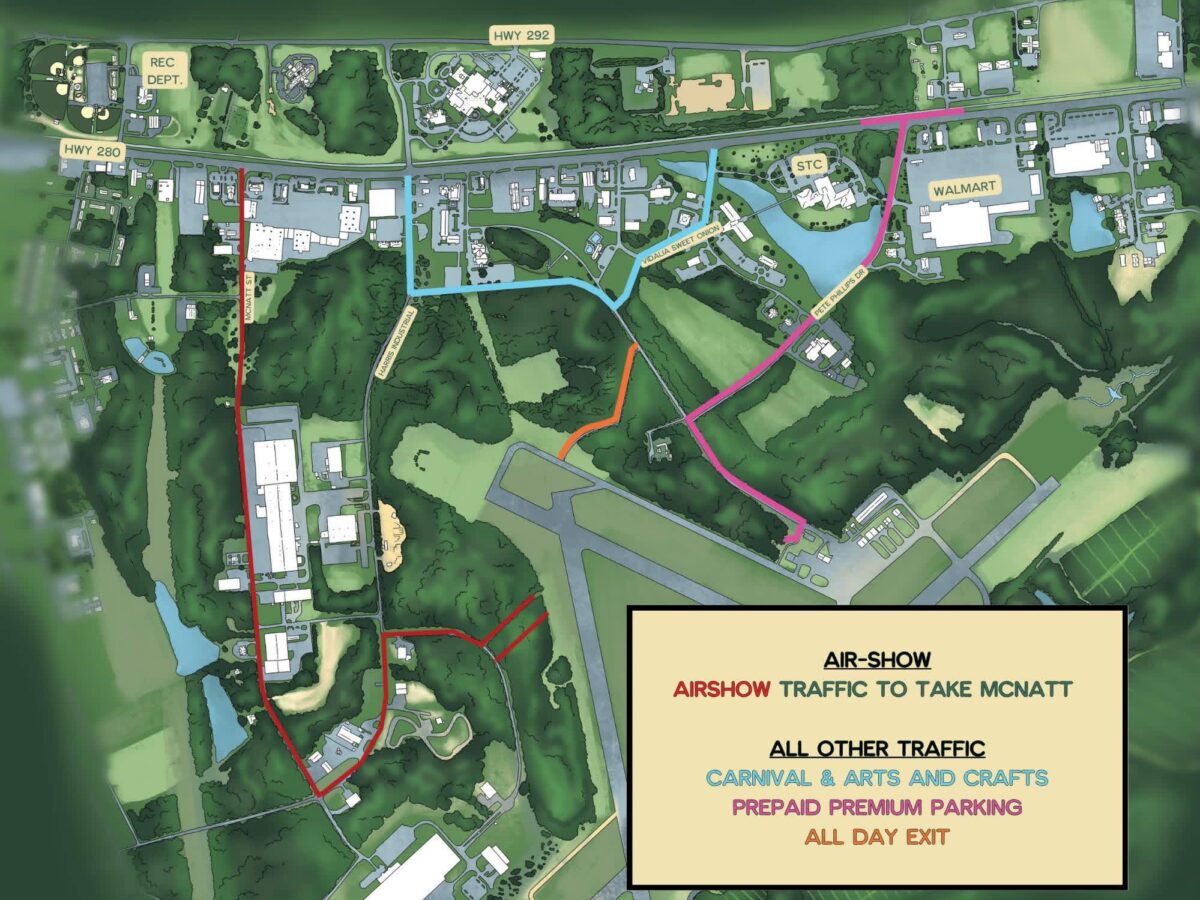 Map showing traffic routes for an airshow and other events. Airshow traffic is directed to take McNatt Street, marked in red. Other traffic for carnival, arts and crafts, prepaid premium parking, and all-day exit is directed along routes marked in blue, pink, and orange. Key landmarks include Walmart, STC, Rec Dept., and highways 280 and 292. Roads are color-coded to indicate different traffic flows. The map includes green areas representing forests and open spaces, with buildings and parking lots in light blue and white.