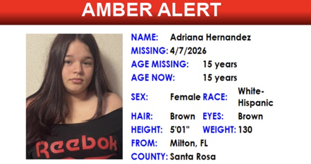 Adriana Hernandez, a 15-year-old female, White-Hispanic, with brown hair and brown eyes, 5'01" tall, weighing 130 pounds, last seen missing on 4/7/2026 from Milton, FL, Santa Rosa County. She is wearing a black Reebok shirt in the photo.