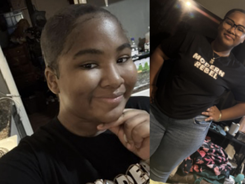 A person with short hair and glasses is wearing a black t-shirt with the words "MODERN REBEL" printed on it. In the left image, they are smiling with their hand resting under their chin. In the right image, they are standing with one hand on their hip, wearing blue jeans, and smiling. The background shows a cluttered room with various items and furniture.